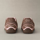 Brown and pink sneaker on a beige background with HelloKitty charm lightweight y2k retro shoes old order 